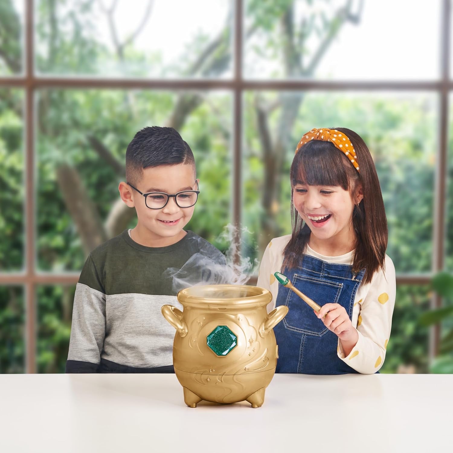 - Magical Real Misting Gold Cauldron with 8 Inch Non-Electronic Plush Toy. Follow the Spell Book Add the Magic Ingredients. Who Will You Magically Create?