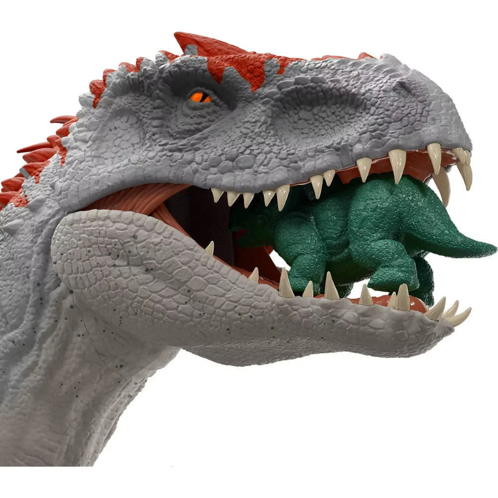 Toy dinosaur figure with a smaller green dinosaur inside its mouth on a white background