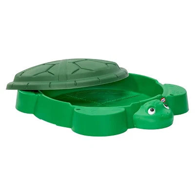 Green turtle-shaped toy on a white background