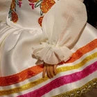 Barbie Signature Doll, Día De Muertos 2025 Collectible in Ruffled Cream Gown Trimmed with Marigolds and Ribbon, Flower Crown and Calavera Face Paint