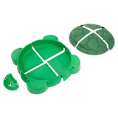 Green turtle-shaped toy with detachable pieces on a white background